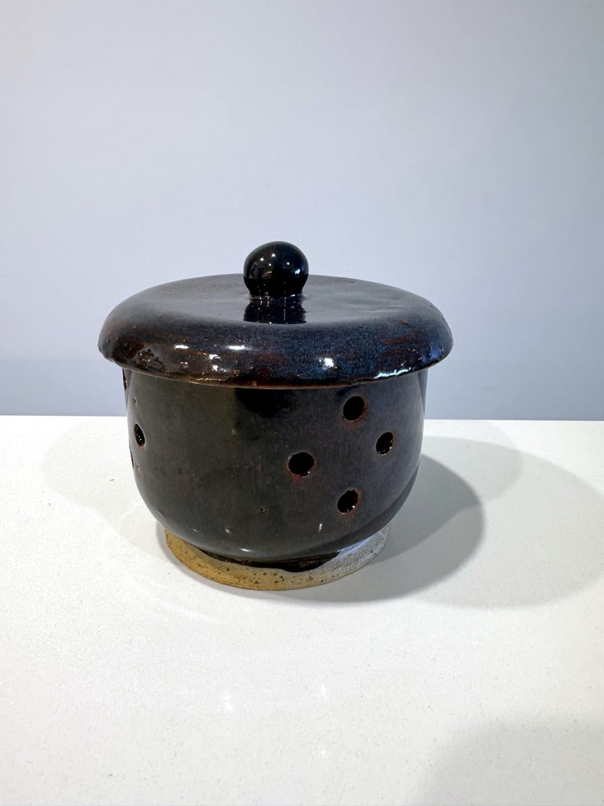 Oil burner, handmade stoneware, on the studio bench